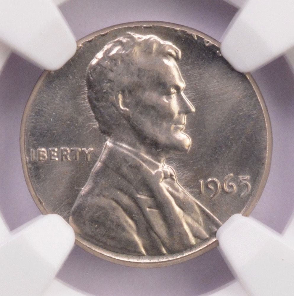 1965 penny struck on a Roosevelt dime planchet error coin showing undersized coin with partial Lincoln design