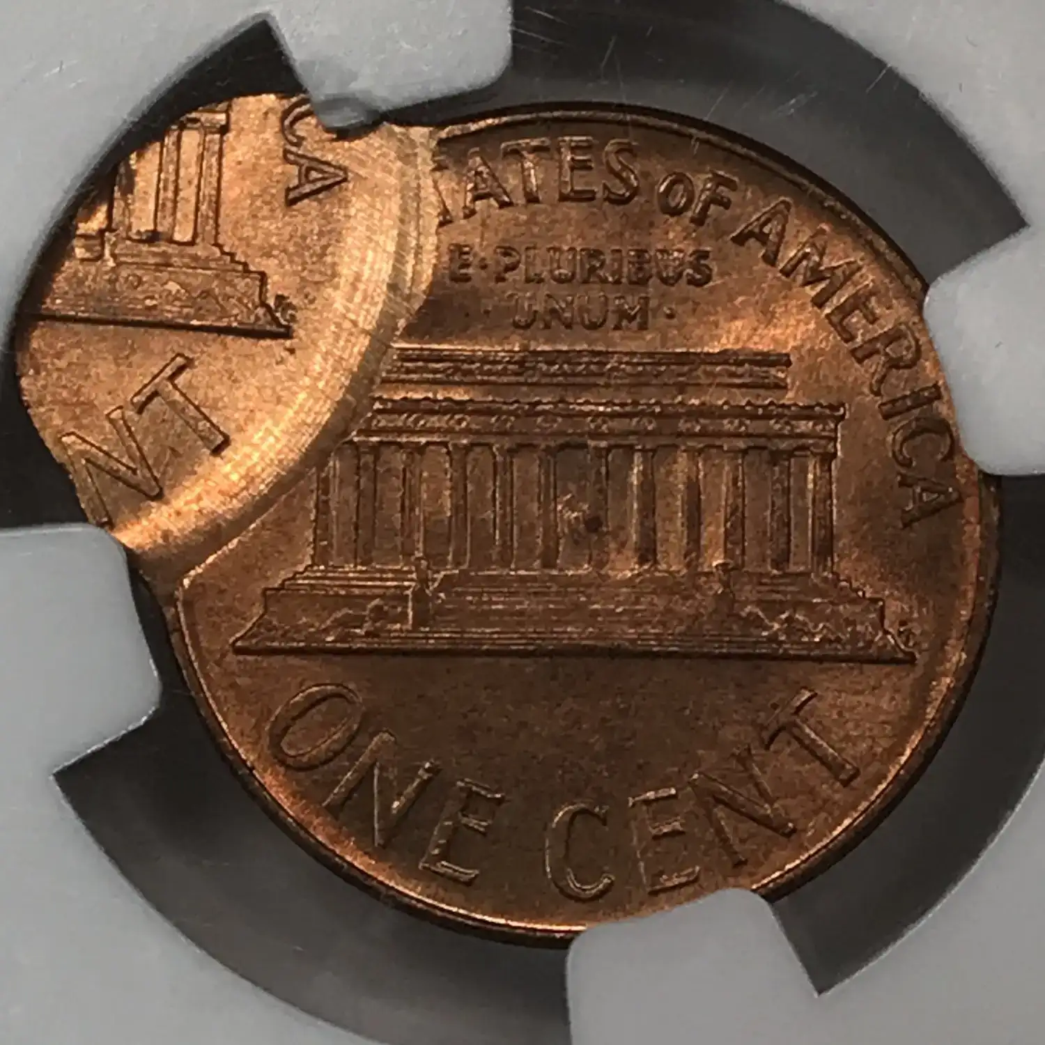 1965 penny off-center strike error showing blank crescent of unstruck planchet on one side
