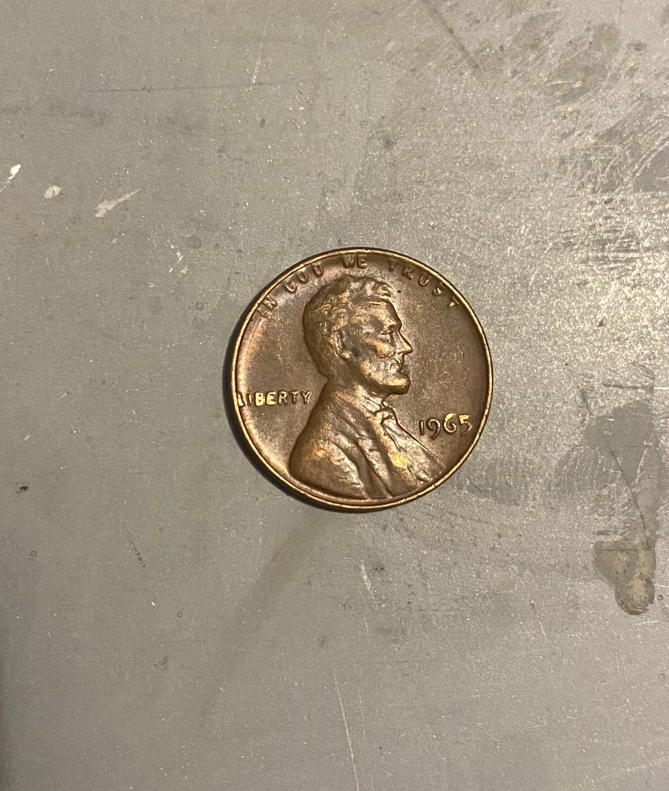 1965 penny doubled die obverse error showing visible doubling on LIBERTY letters and date under magnification